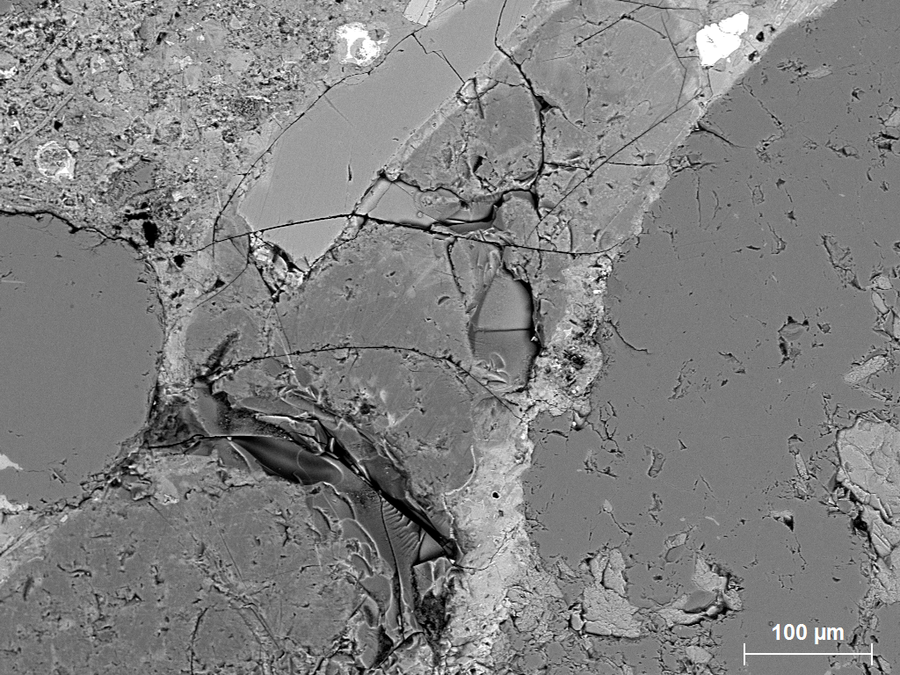 Microscopic view of the alkali-reactive aggregates in concrete.